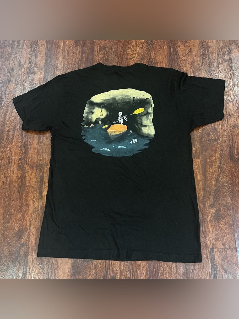 Tultex Black Tee with Skeleton Kayak Cave Illustration